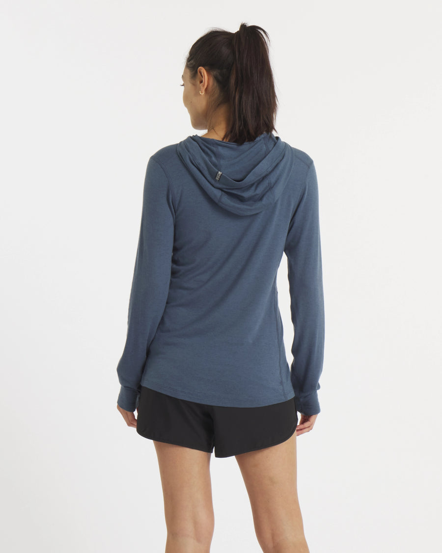 Back of Model in Sol Navy Women's UV Protection Sun Hoodie – PAKA Apparel