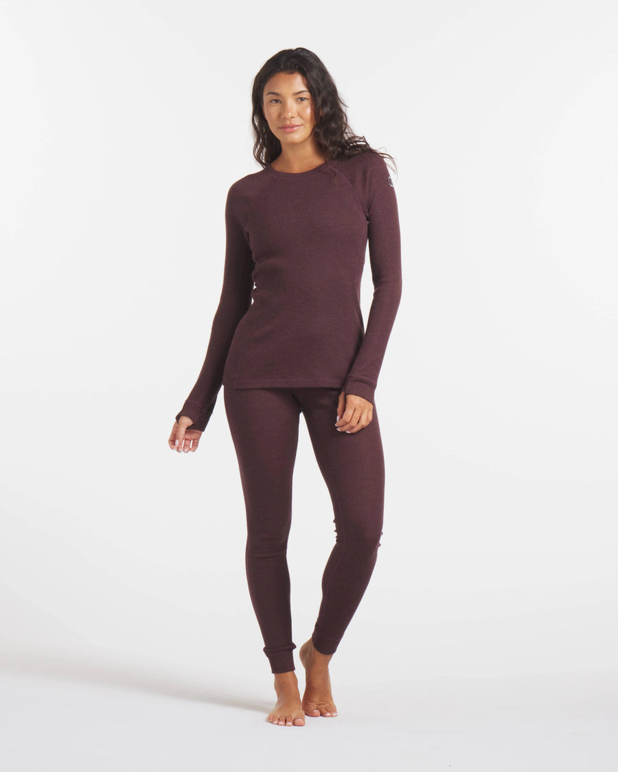 Full-body front view of Women’s 1.0 Thermal Crew showcasing rib-knit long-sleeve crew top and matching thermal leggings in uva dark purple on white background