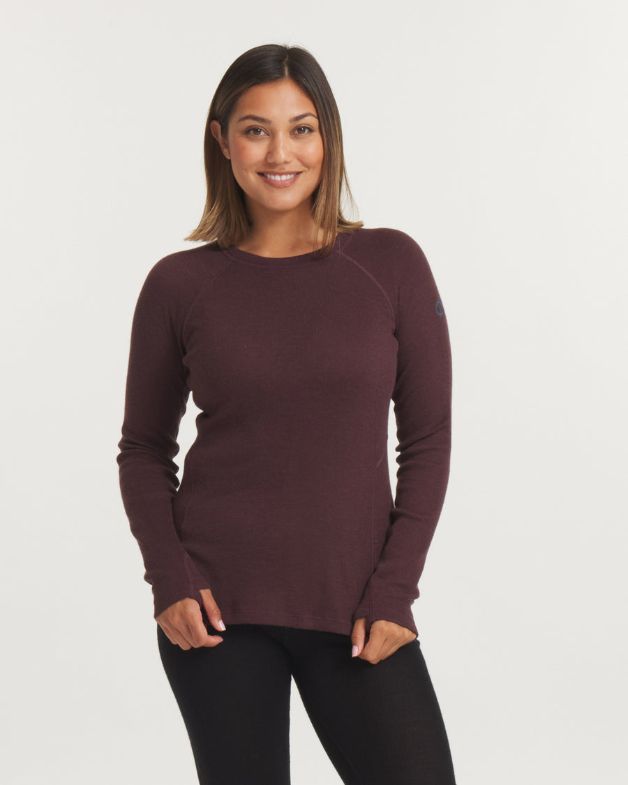 Front view of Women’s Thermal Crew alpaca baselayer top in burgundy showing slim fit, raglan sleeves and thumbholes