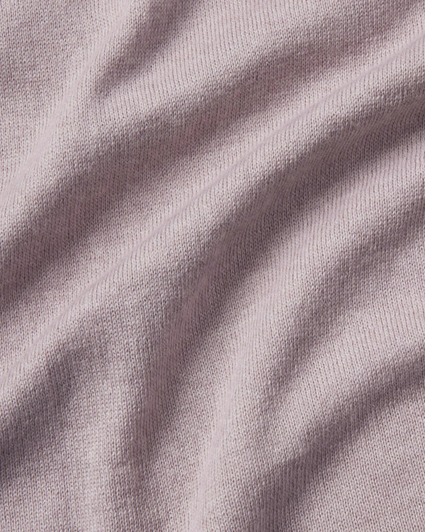 Close-up of textured purple fabric with folds