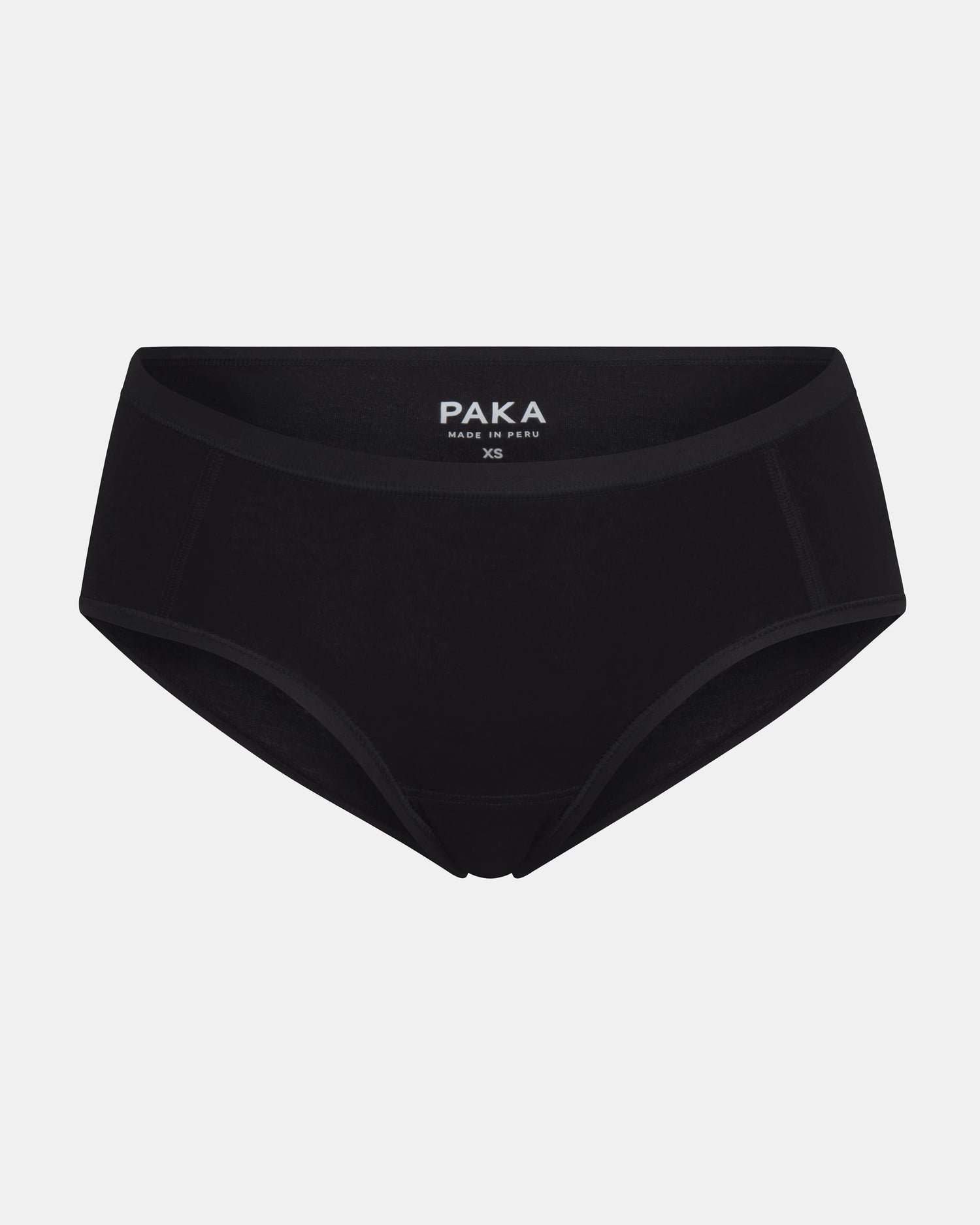 Front view of Women’s Essential Boy Short in black showing coverage and elastic waistband with visible PAKA logo