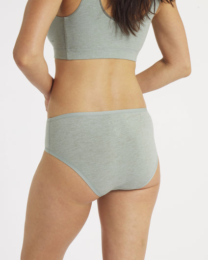 Back view of women’s essential mid-rise brief in lichen on model showing mid-rise fit and full rear coverage