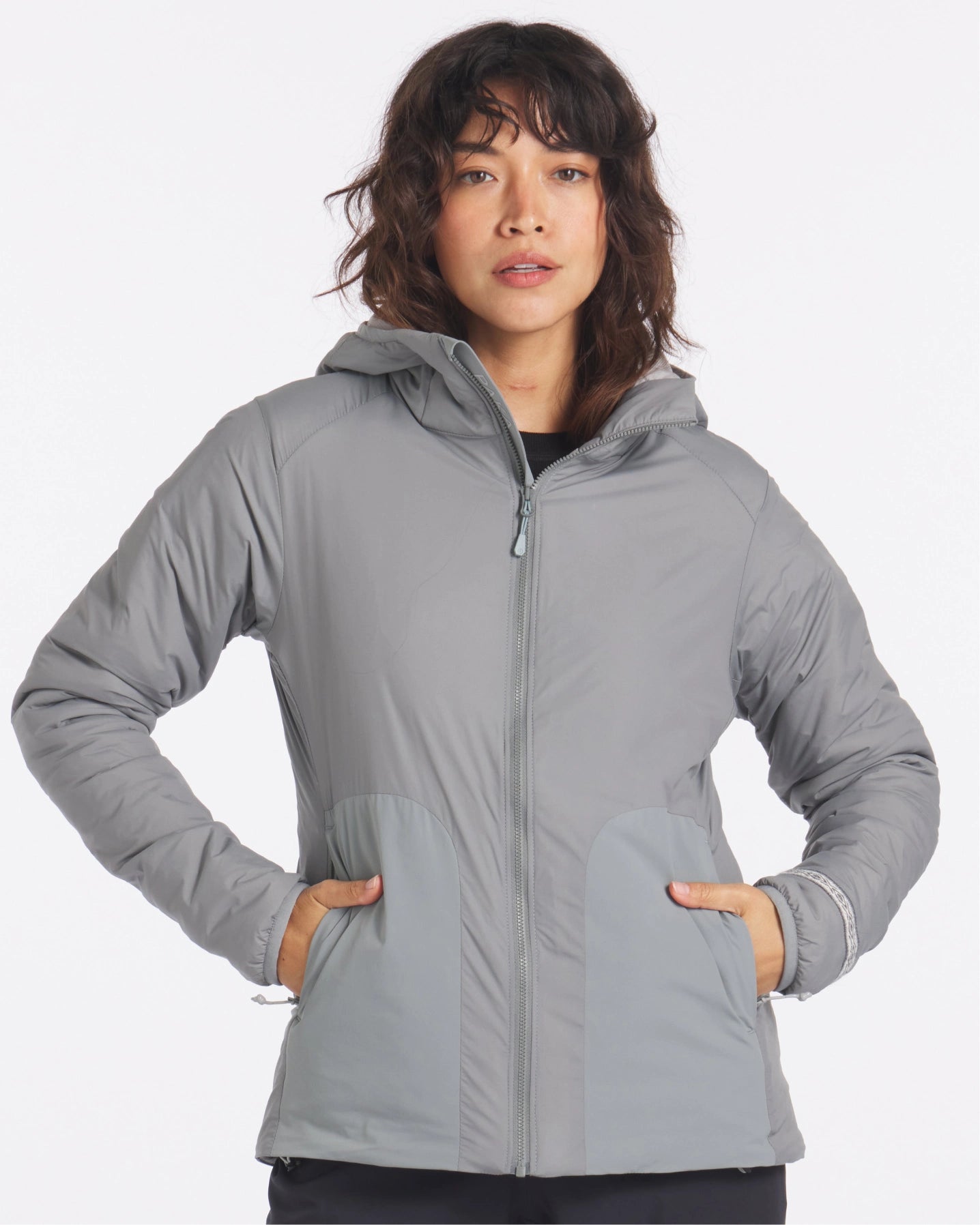 Model with Hands in Pockets of Storm Grey Women's Apu Lightweight Sustainable Puffer Jacket – PAKA Apparel
