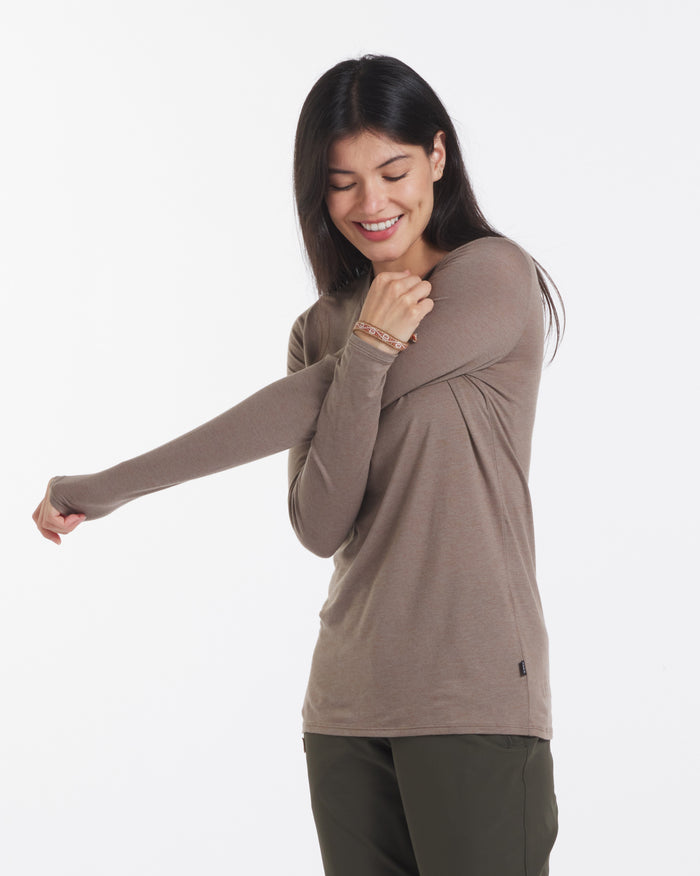 Women Stretching Wearing Aire Natural Alpaca Fiber Long Sleeve Shirt in Walnut / Tan – PAKA Apparel