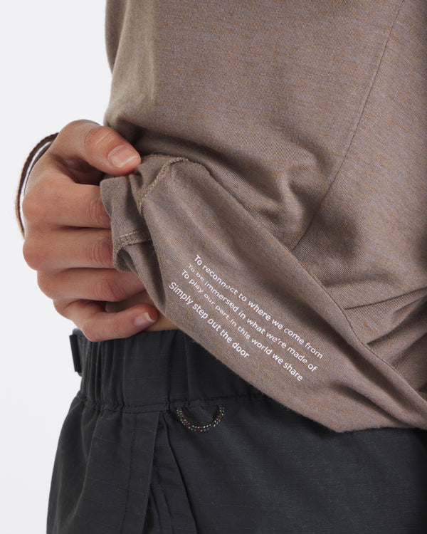 Close-up of Women’s Aire long sleeve in walnut showing white inner hem print Simply step out the door