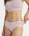Front three quarter view of Womens Mid-Rise Brief in lilac on model showing mid-rise fit and breathable fabric