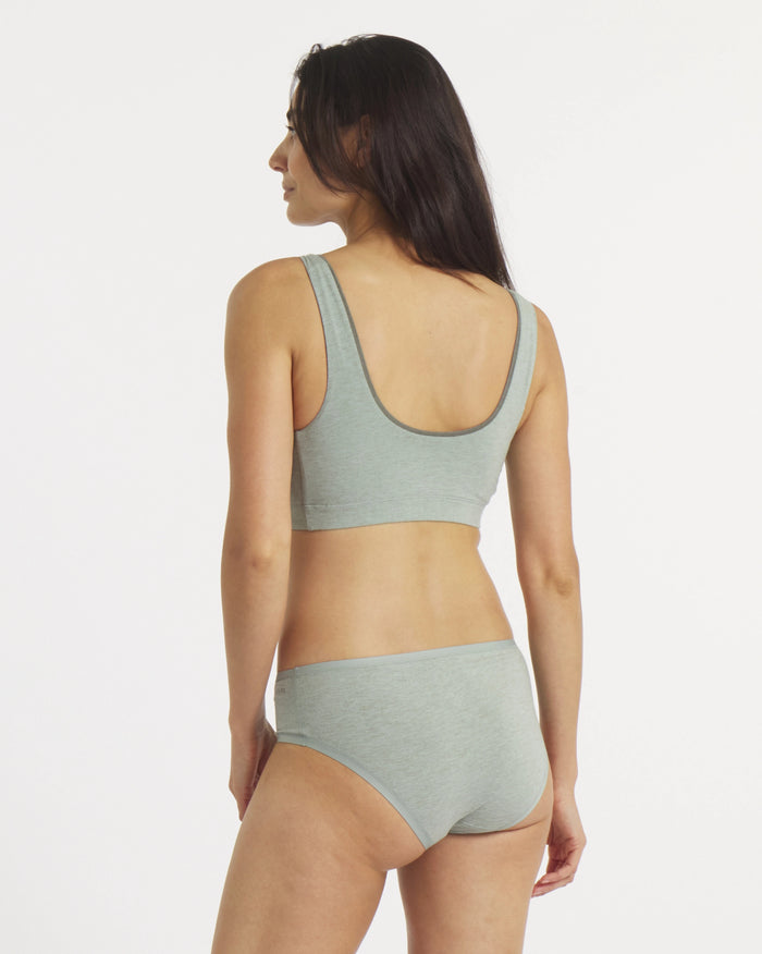 Rear view of Women’s Essential Scoop Bralette in Lichen on model showcasing low scoop back and wide straps on white background