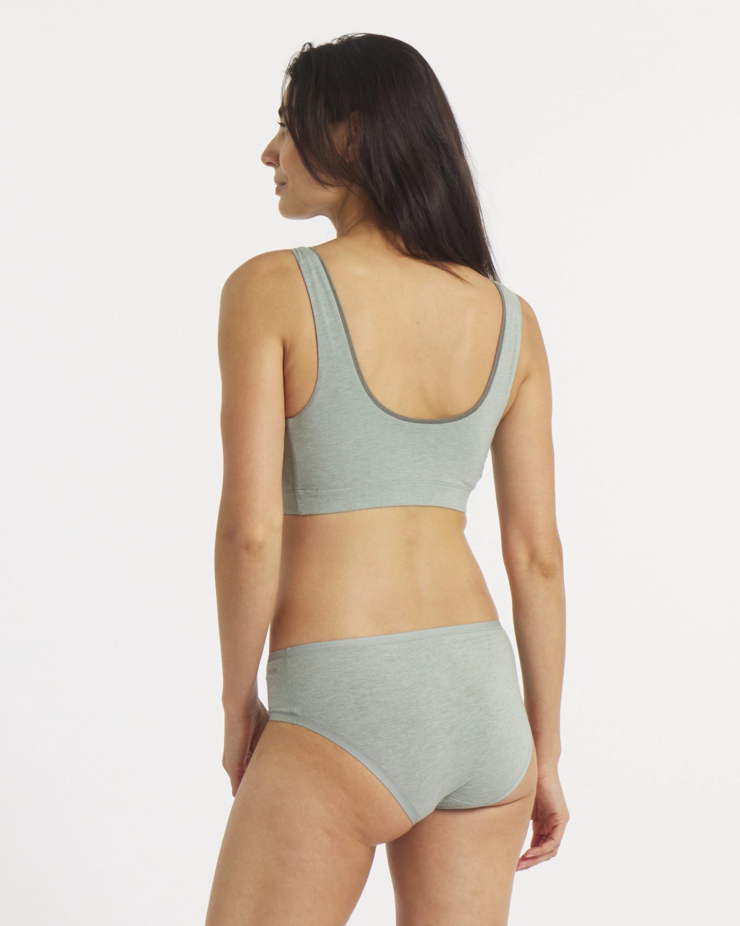 Rear view of Women’s Essential Scoop Bralette in Lichen on model showcasing low scoop back and wide straps on white background