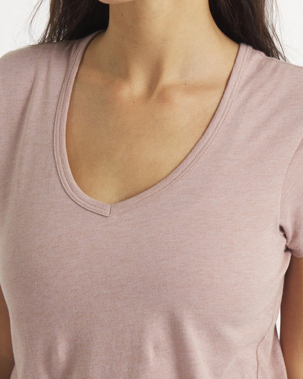 Front close-up of Women’s Essential V-neck tee in magnolia showing v-neck and seam detail on model, white background