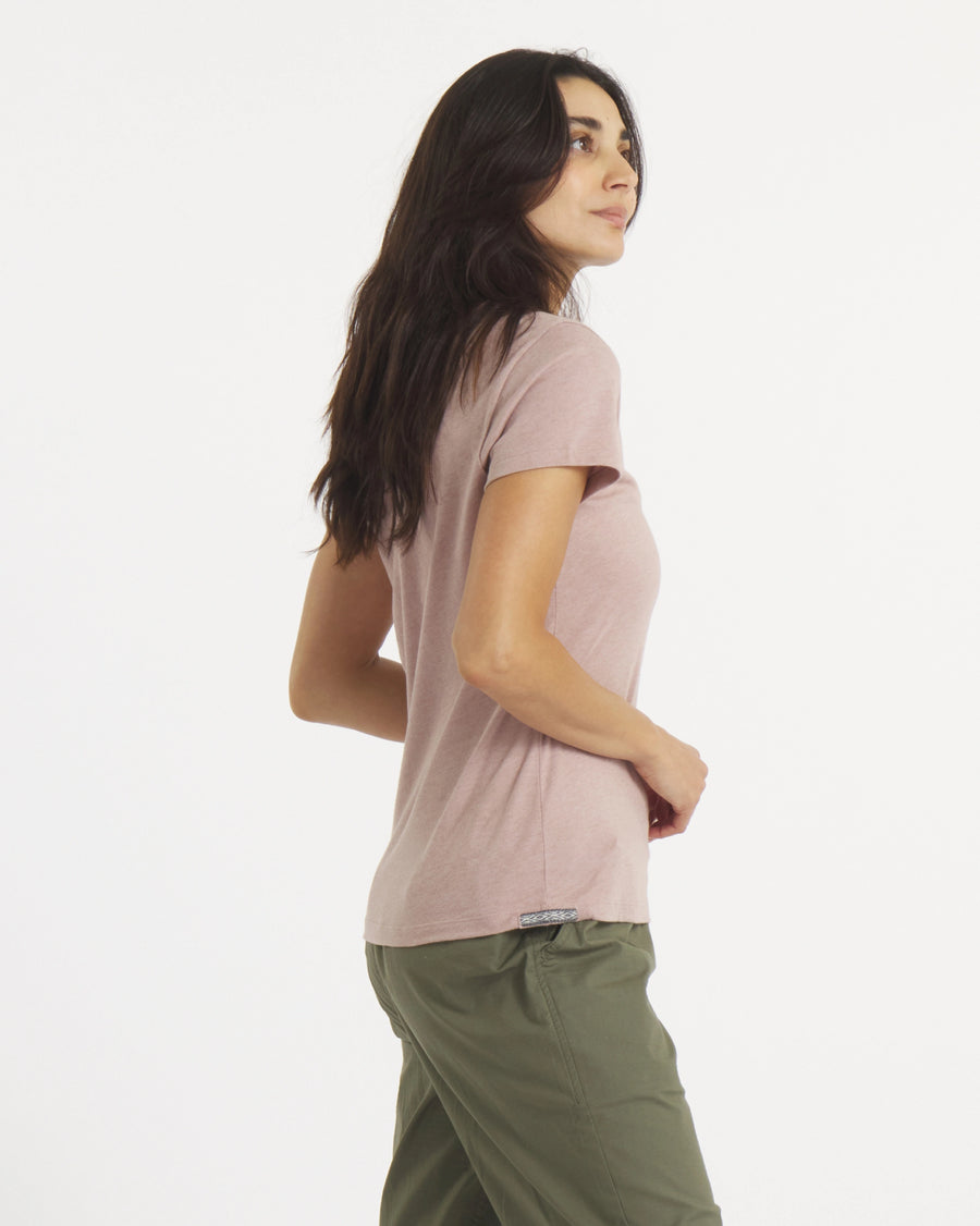 Three-quarter back view of Women’s Essential V-neck t-shirt in magnolia showing short sleeves, regular fit and side hem tag on white background