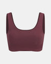 Front view of women’s scoop bralette in raisin showing scoop neckline, wide straps and seamless knit on light gray background