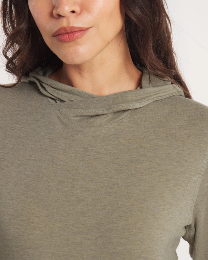 Close-up front view of Women’s Sol Hoodie on model in elm showing crossover hood and soft lightweight fabric against white background