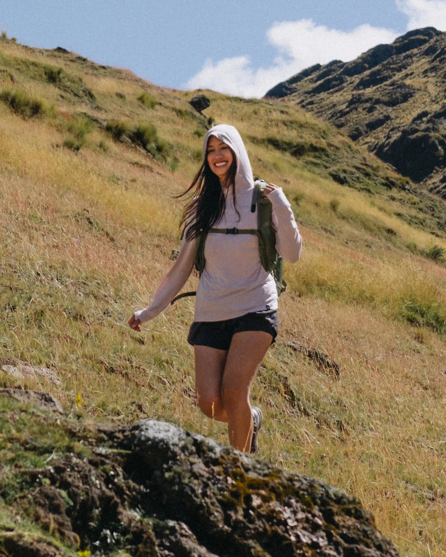 Women Named Chaska Hiking on Mountainside in Sol Women's Sun Hoodie in Lilac / Light Pink – PAKA Apparel