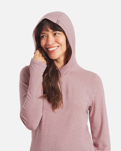 Front view of Women’s Sol Hoodie in Woodrose on model with hood up and visible thumbhole, regular fit, white background