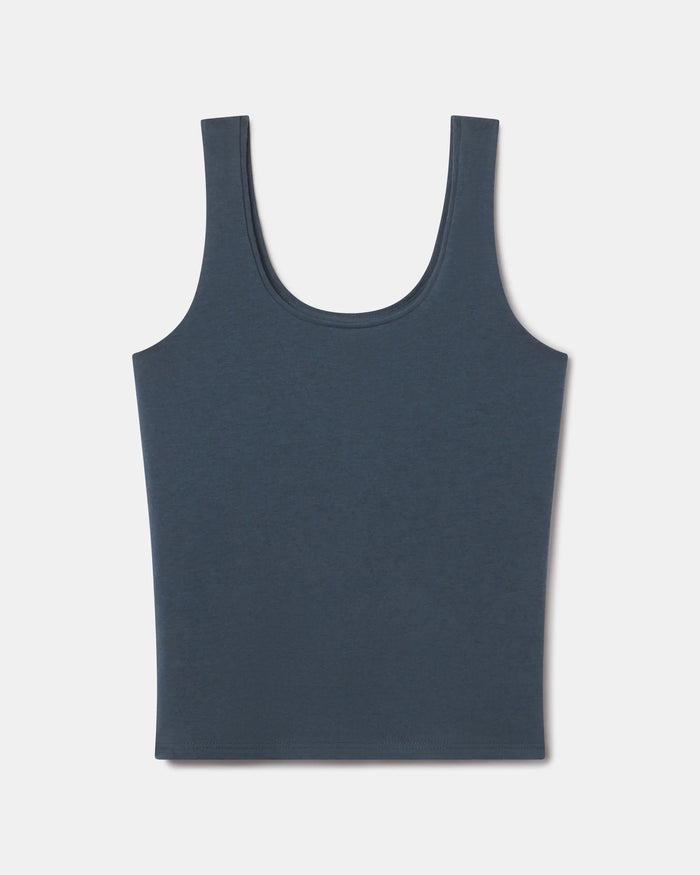 Front view of Women’s Essential Tank showcasing scoop neckline and wide straps on light gray background
