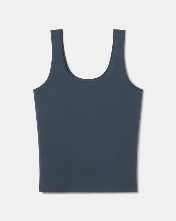 Front view of Women’s Essential Tank showcasing scoop neckline and wide straps on light gray background