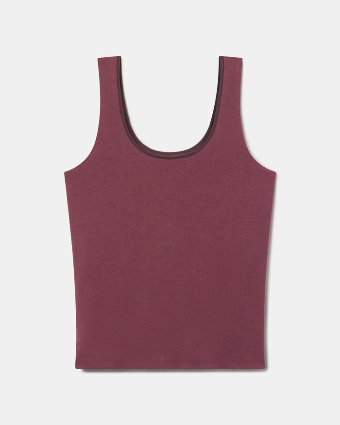 Flat lay of Women’s Essential Tank in raisin showing built-in shelf bra and scoop neck on light gray background