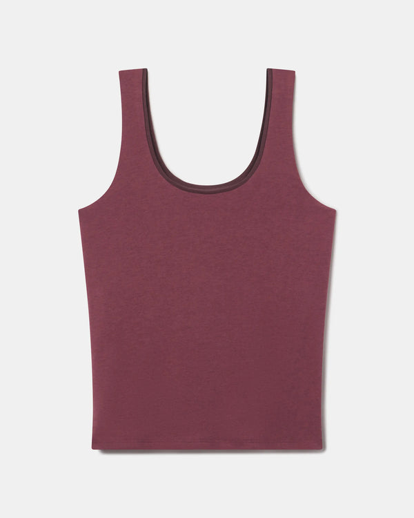 Flat lay of Women’s Essential Tank in raisin showing built-in shelf bra and scoop neck on light gray background