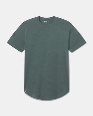 Front view of Women’s Essential Tee in Balsam showcasing crew neck and curved hem on light gray background