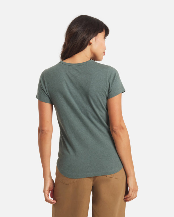 Back view of Essential Tee in balsam showing short sleeves, crewneck, and regular fit on model against white background