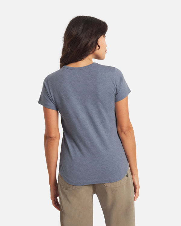 Back view, Women’s Essential Tee, bluestone, regular fit crewneck with short sleeves and curved hem on white background