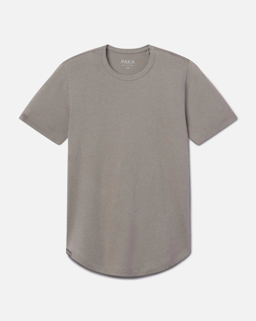 Front view of Women’s Essential Tee in stone showing crewneck, short sleeves, and curved hem on light gray background