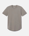 Front view of Women’s Essential Tee in stone showing crewneck, short sleeves, and curved hem on light gray background