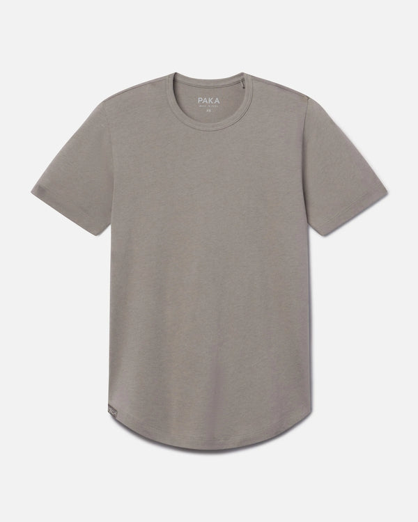 Front view of Women’s Essential Tee in stone showing crewneck, short sleeves, and curved hem on light gray background
