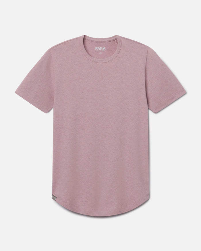 Front view of Women’s Essential Tee in woodrose showcasing curved hem and ribbed crewneck on light gray background