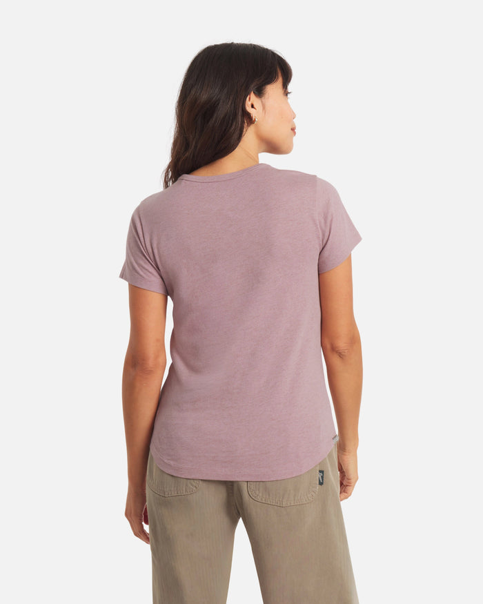 Back view of Women’s Essential Tee in Woodrose showcasing short sleeves, regular fit, crewneck and curved hem on a light background