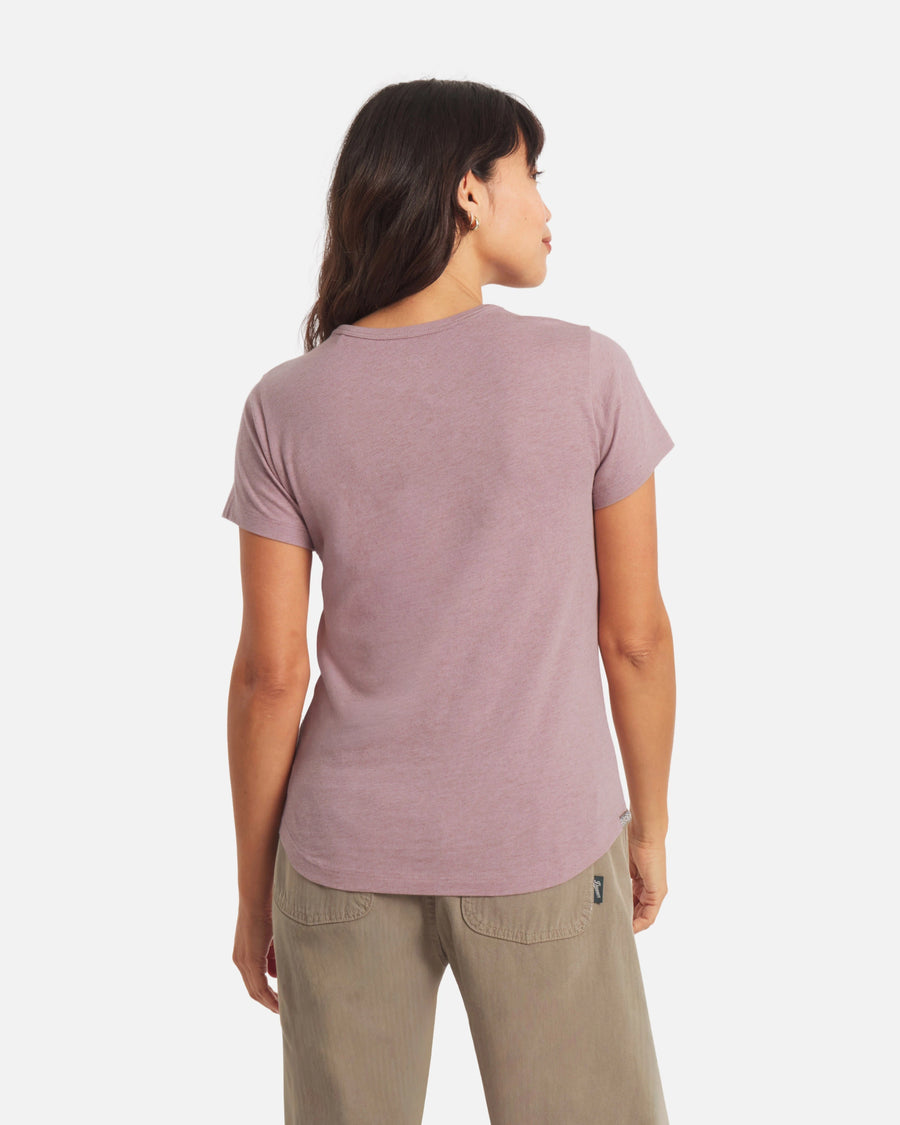 Back view of Women’s Essential Tee in Woodrose showcasing short sleeves, regular fit, crewneck and curved hem on a light background