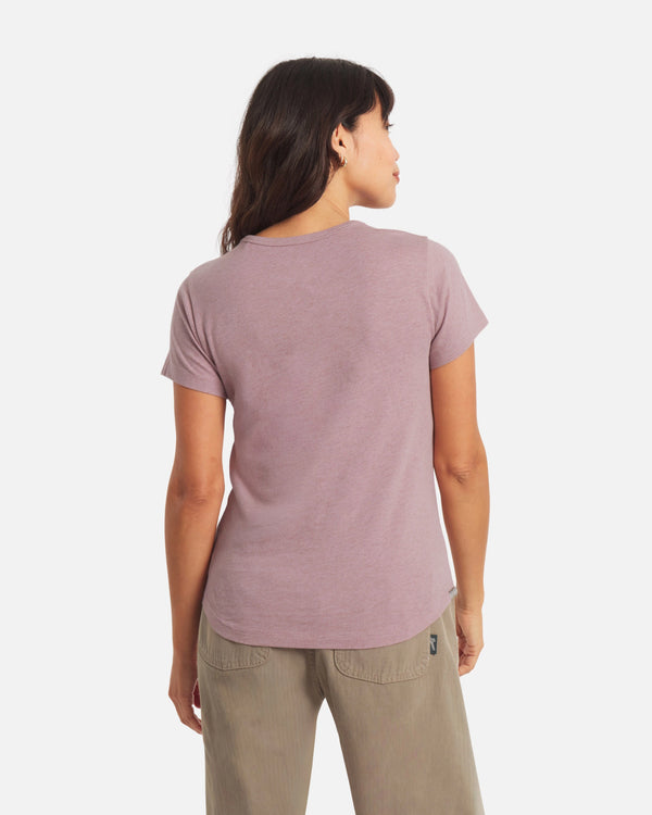 Back view of Women’s Essential Tee in Woodrose showcasing short sleeves, regular fit, crewneck and curved hem on a light background