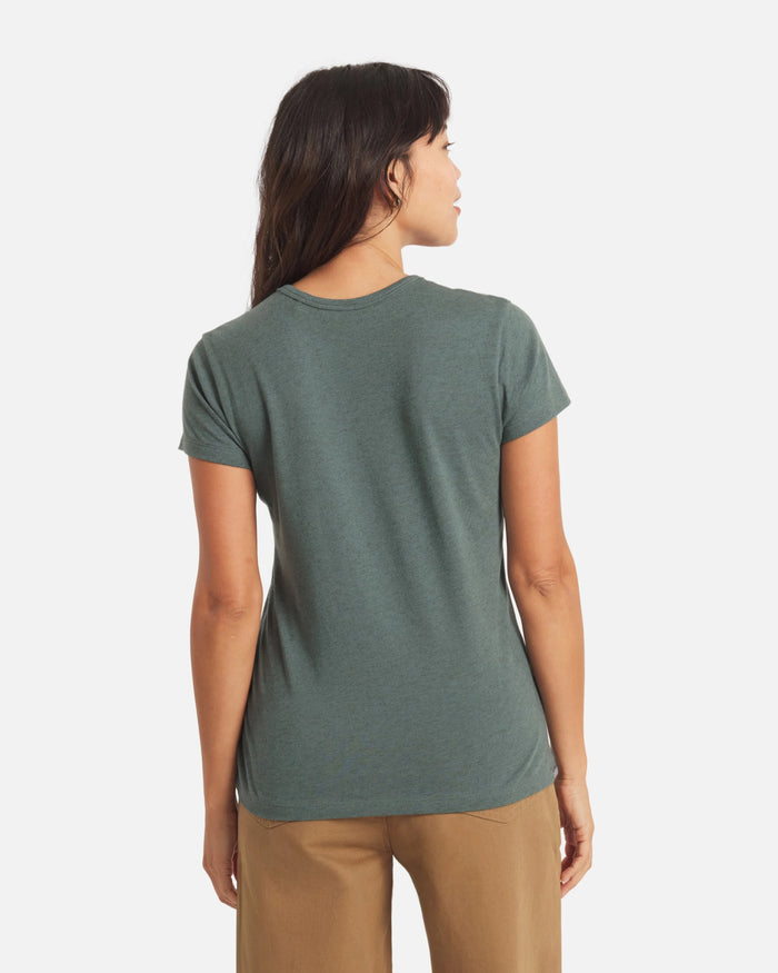 Back view of Women’s Essential V-neck t-shirt in Balsam on model, showing short sleeves and regular fit on white background