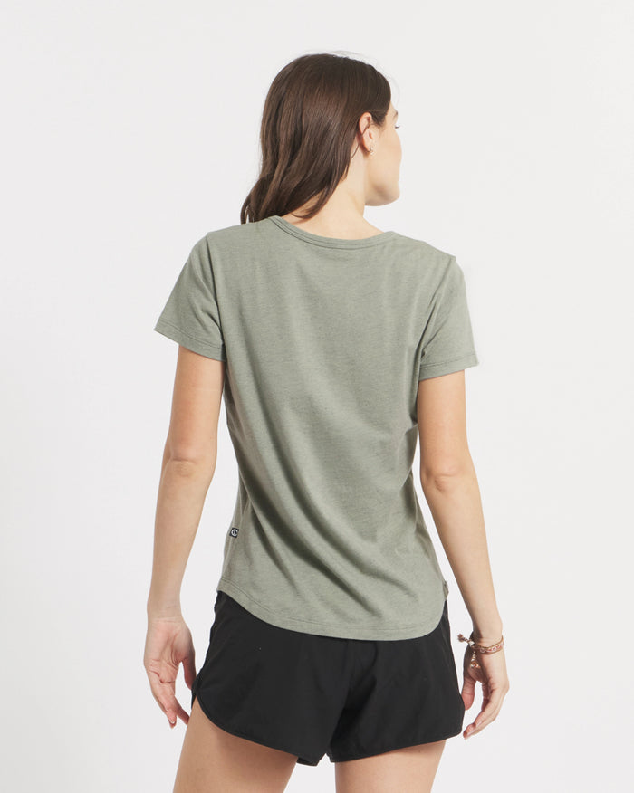 Back view of Women’s Essential V-neck t-shirt in Willow with short sleeves, curved hem, and regular fit on white background