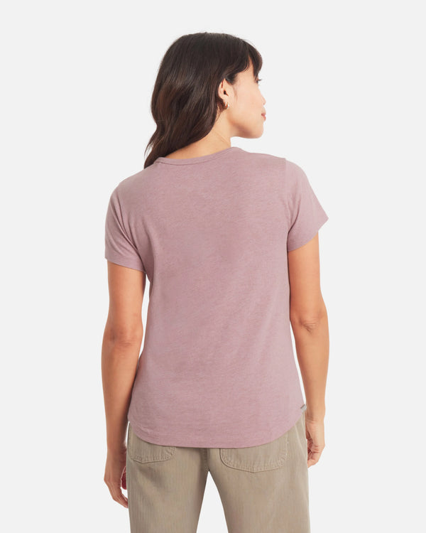 Back view of Women’s Essential V-neck t-shirt in Woodrose showcasing short sleeves, curved hem, and regular fit on a white background