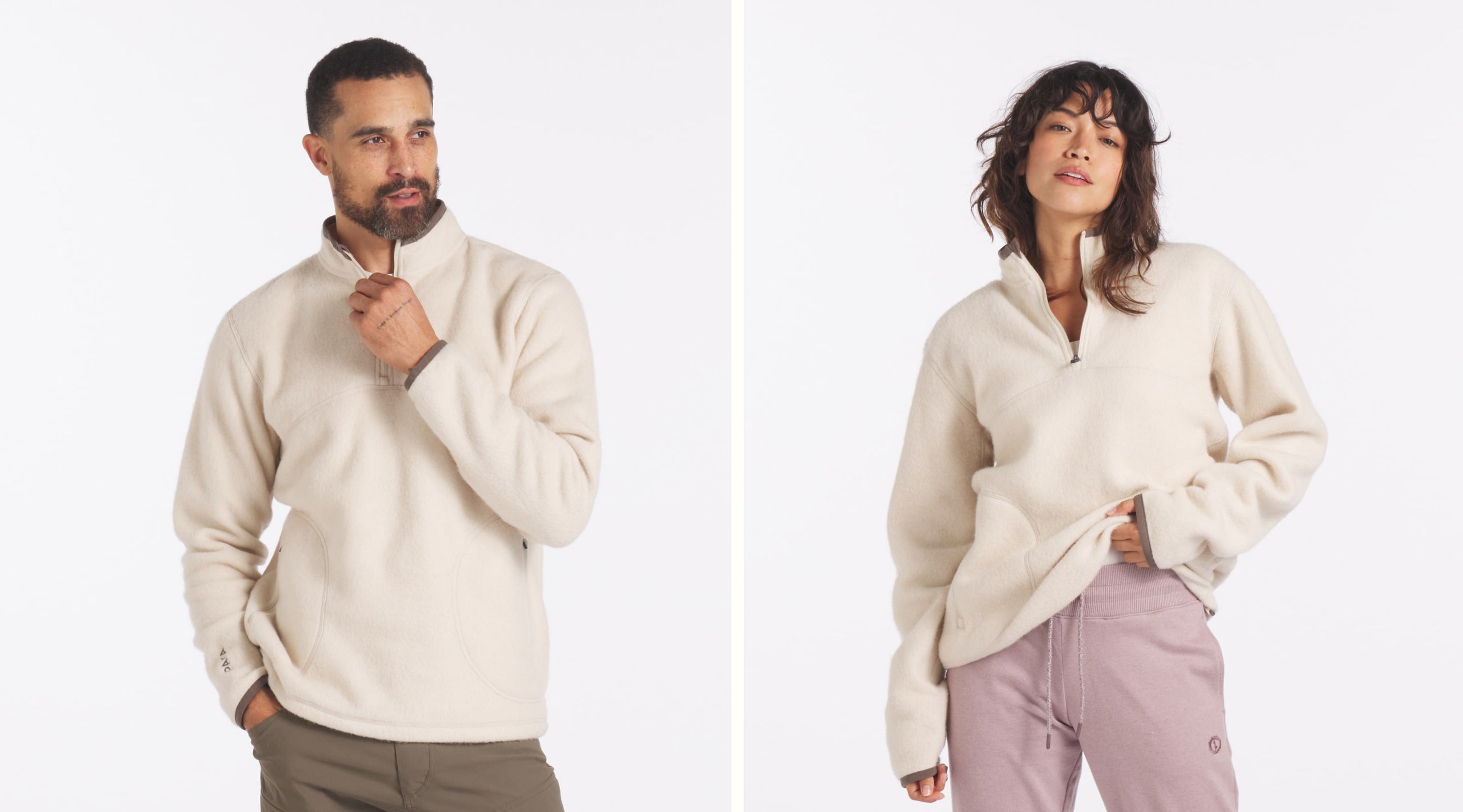 Two models wearing PAKACLOUD alpaca fleece jackets standing on a rocky trail
