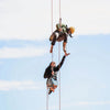 Two women suspended from a great height having fun together