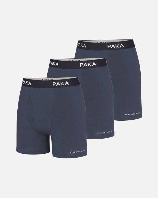 Three-quarter front view of Men’s Essential navy boxer brief 3-pack showing PAKA branded elastic waistbands on light gray background