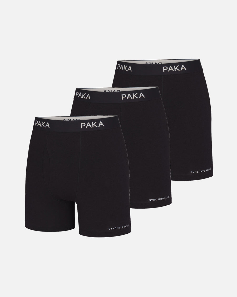 Three-quarter front view of men’s black boxer briefs 3-pack showing PAKA waistband and SYNC INTO NATURE hem on light background