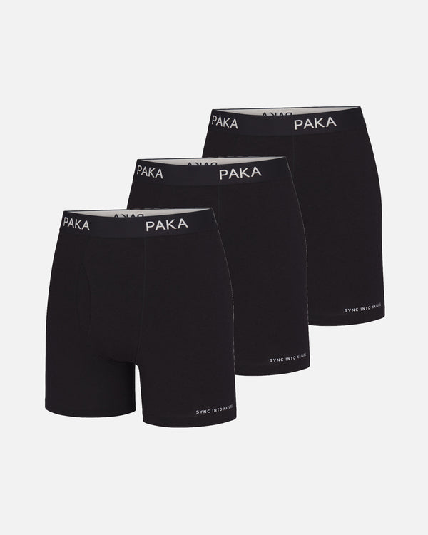 Three-quarter front view of men’s black boxer briefs 3-pack showing PAKA waistband and SYNC INTO NATURE hem on light background