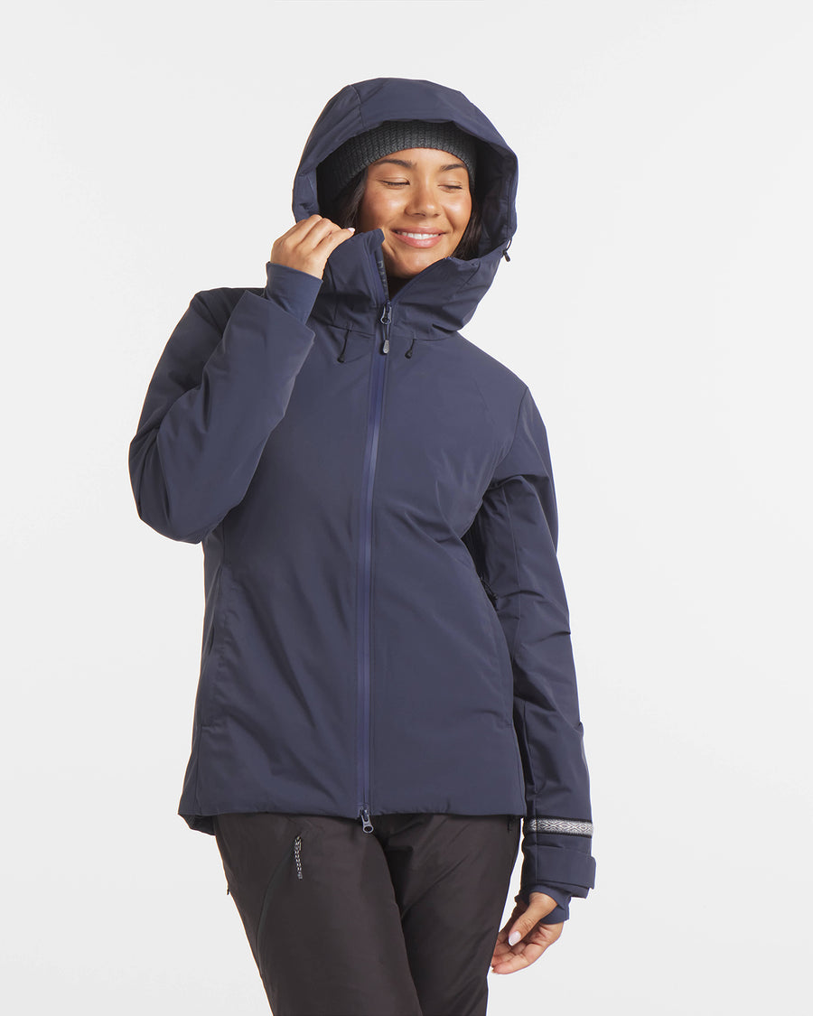 Model with Hood Up on Navy Blue Women's Apu Parka Waterproof Jacket with Alpaca Insulation – PAKA Apparel