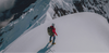 Climber on Peak of Snowy Mountain in Red Apu Puffer Jacket – PAKA Apparel