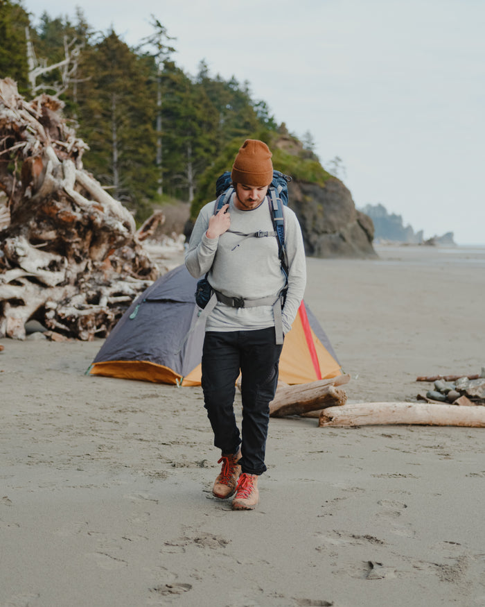 Man Hiking Along Beach in Heather Grey Aire Lightweight Alpaca Long Sleeve Shirt – PAKA Apparel