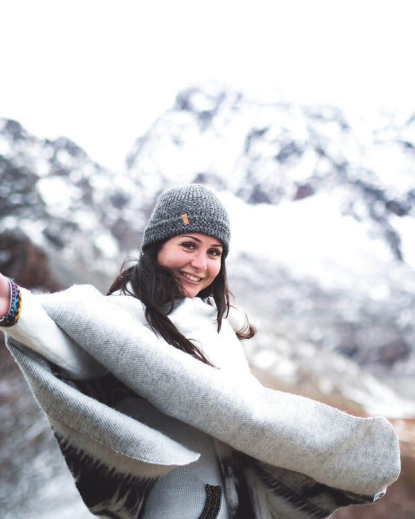 Paka Charcoal Beanie at Rainbow Mountain, Peru on woman model