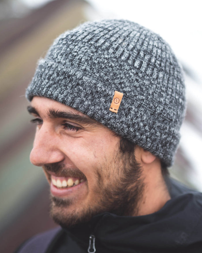 Paka Charcoal Beanie at Rainbow Mountain, Peru on man