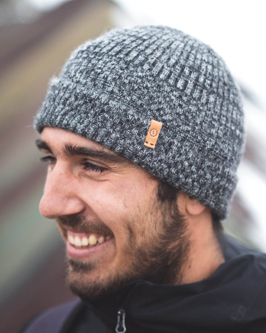 Paka Charcoal Beanie at Rainbow Mountain, Peru on man