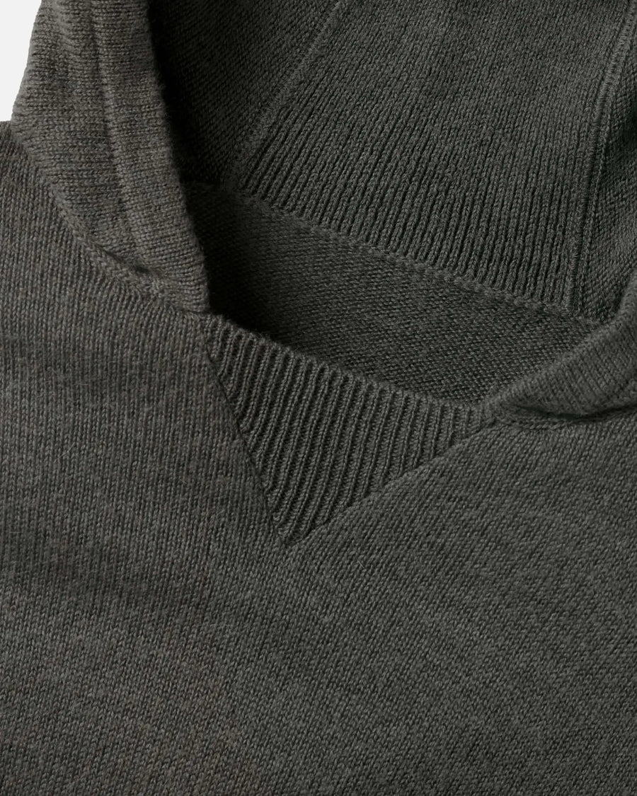 Close-up of The Hoodie alpaca hood and neckline showing ribbed V-insert and soft knit texture on white background