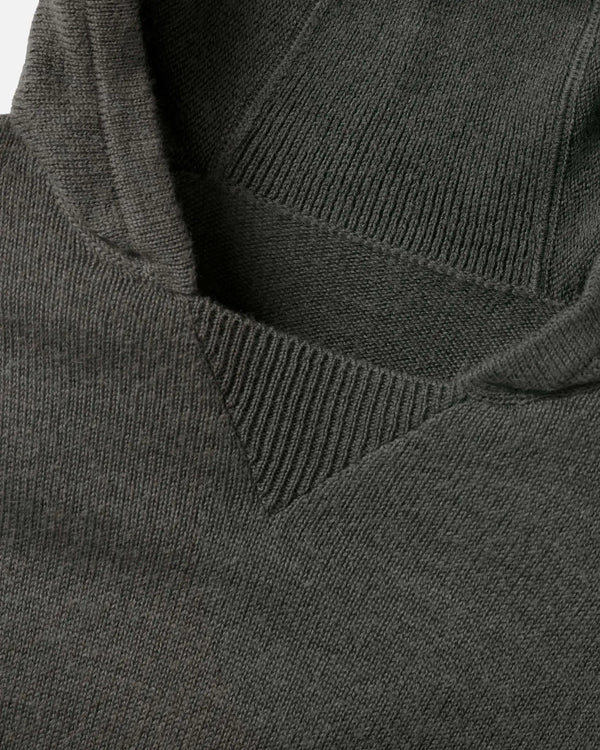 Close-up of The Hoodie alpaca hood and neckline showing ribbed V-insert and soft knit texture on white background