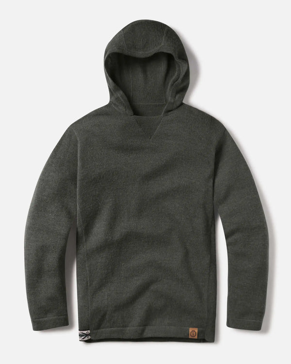 Flat-lay front of The Hoodie in Andean Moss showing hood, ribbed V-neck, leather logo patch and hem tab on gray background
