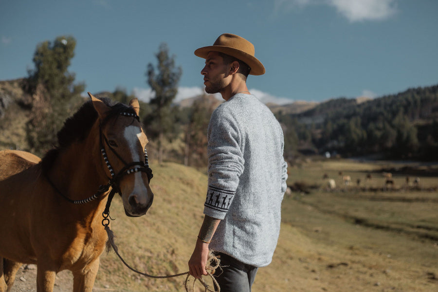 Male Cowboy with horse in Cusco, Peru wearing the Costa